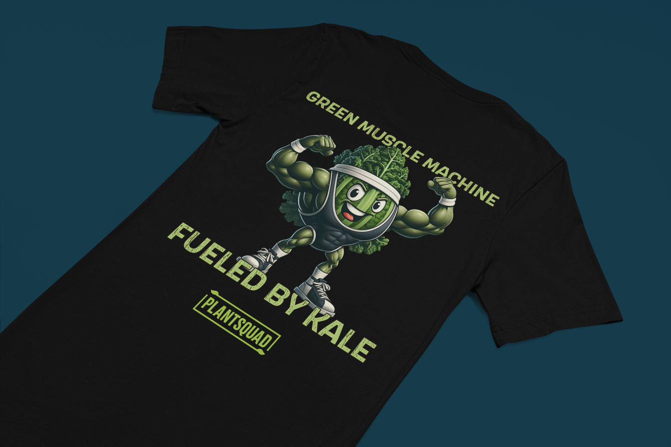 Plantsquad Kale "Green Muscle Machine Fueled By Kale" - Unisex T-Shirt featuring a cartoon kale character with muscular arms, flexing and smiling. The shirt displays the text "GREEN MUSCLE MACHINE" above the character and "FUELED BY KALE" below. Proudly wear your "PLANTSQUAD" mantra at the bottom of this unique design.
