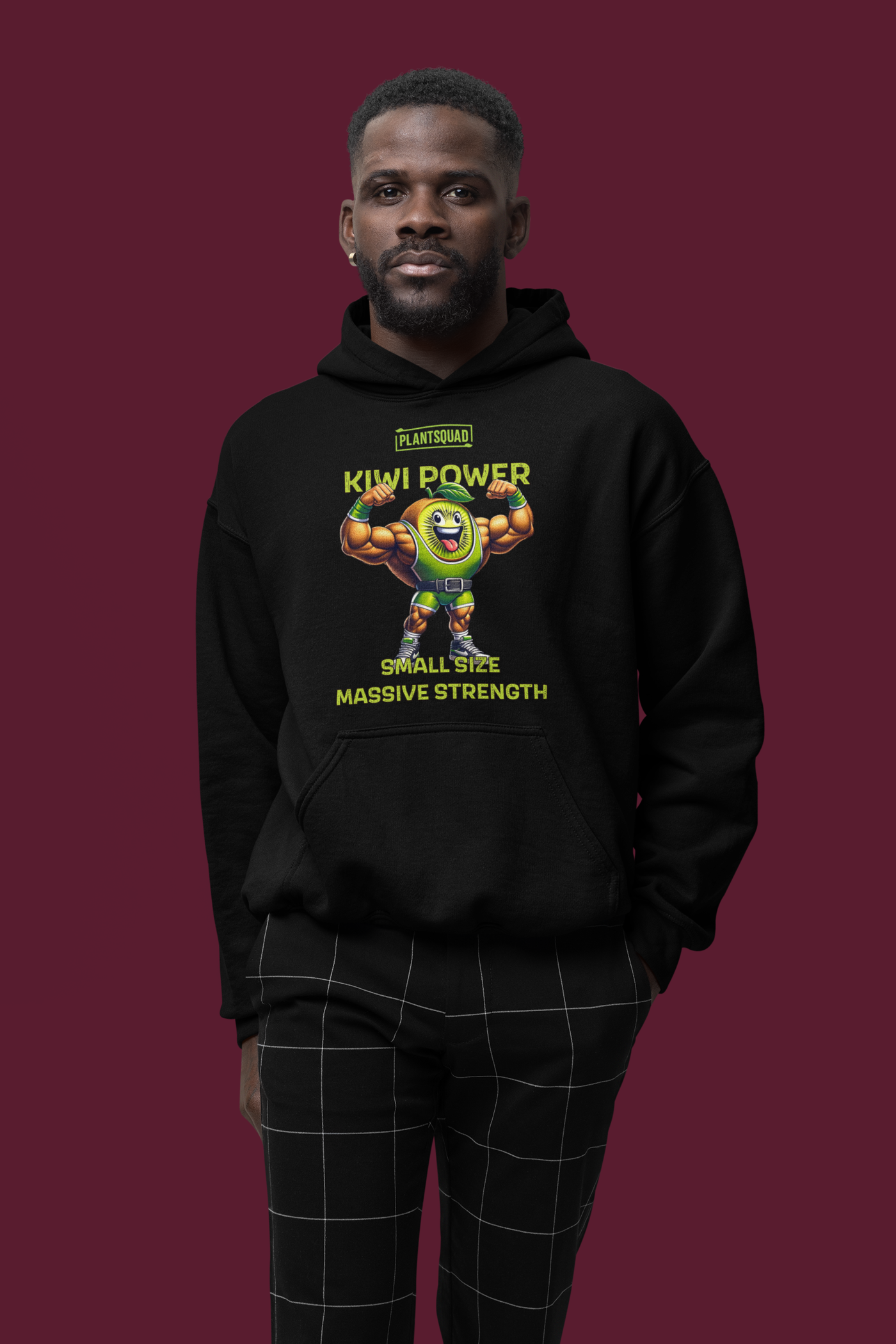 A black weight lifting hoodie featuring a cartoon kiwi character with muscular arms flexing. Above the character is the text "PLANTSQUAD" and "KIWI POWER". Below the character, it reads "SMALL SIZE MASSIVE STRENGTH" in yellow-green font, perfect for showcasing your vegan lifestyle—the Plantsquad Kiwi "Kiwi Power Small Size Massive Strength" - Unisex Hoodie.