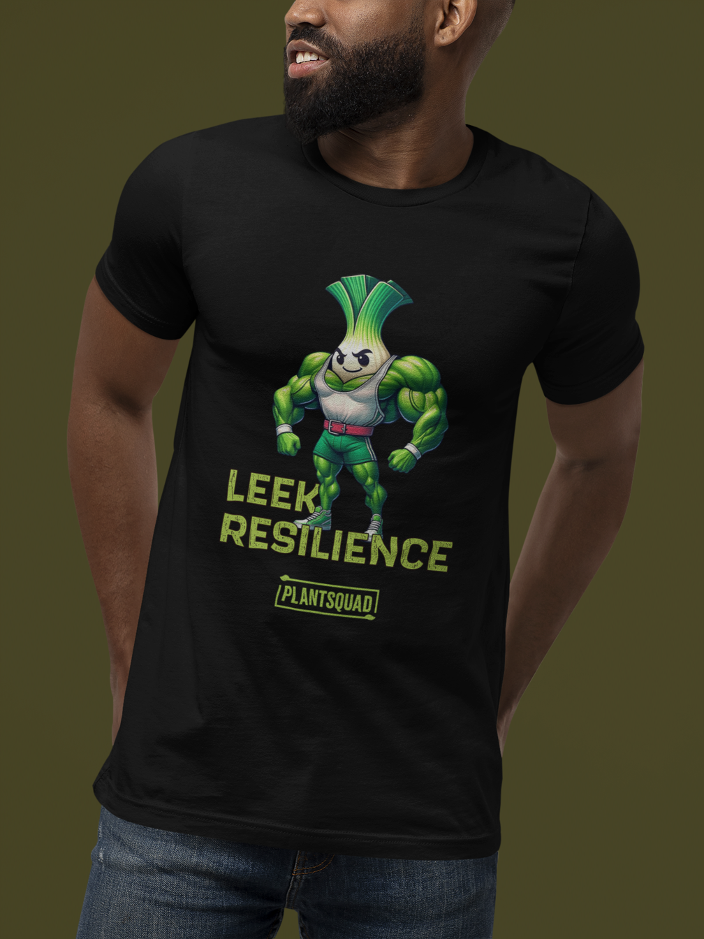 A black T-shirt features a muscular cartoon leek with a determined expression, perfect for embracing a plant-based lifestyle. The leek has a white bulb and green foliage, wearing red shorts. Text reads "Leek Resilience" above and "Plant Squad" below, making it the ultimate fitness t-shirt. Introducing the Plantsquad Leek "Leek Resilience" - Unisex T-Shirt!