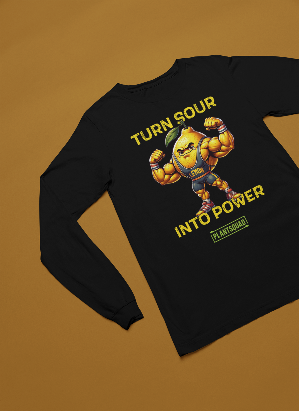 A black long-sleeve shirt features a muscular, anthropomorphic lemon with bulging arms flexed. Above and below the lemon are the phrases "TURN SOUR INTO POWER" in bold yellow letters, promoting a vegan lifestyle. The label "Plantsquad Lemon 'Turn Sour Into Power' - Unisex Long Sleeve T-Shirt" at the bottom aligns perfectly with fitness enthusiasts.