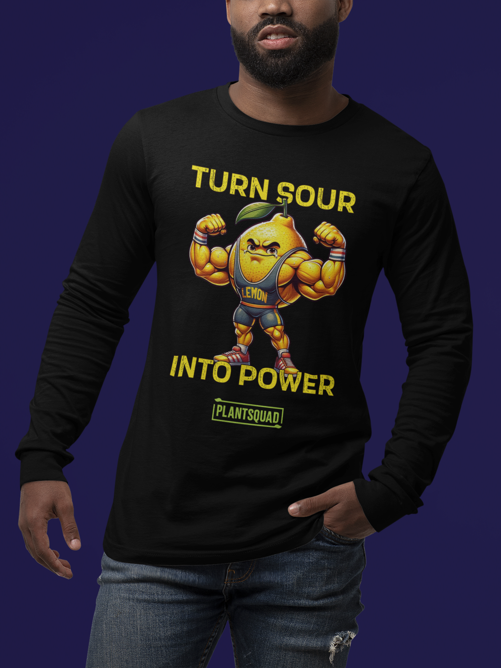 A black long-sleeve shirt features a muscular, anthropomorphic lemon with bulging arms flexed. Above and below the lemon are the phrases "TURN SOUR INTO POWER" in bold yellow letters, promoting a vegan lifestyle. The label "Plantsquad Lemon 'Turn Sour Into Power' - Unisex Long Sleeve T-Shirt" at the bottom aligns perfectly with fitness enthusiasts.