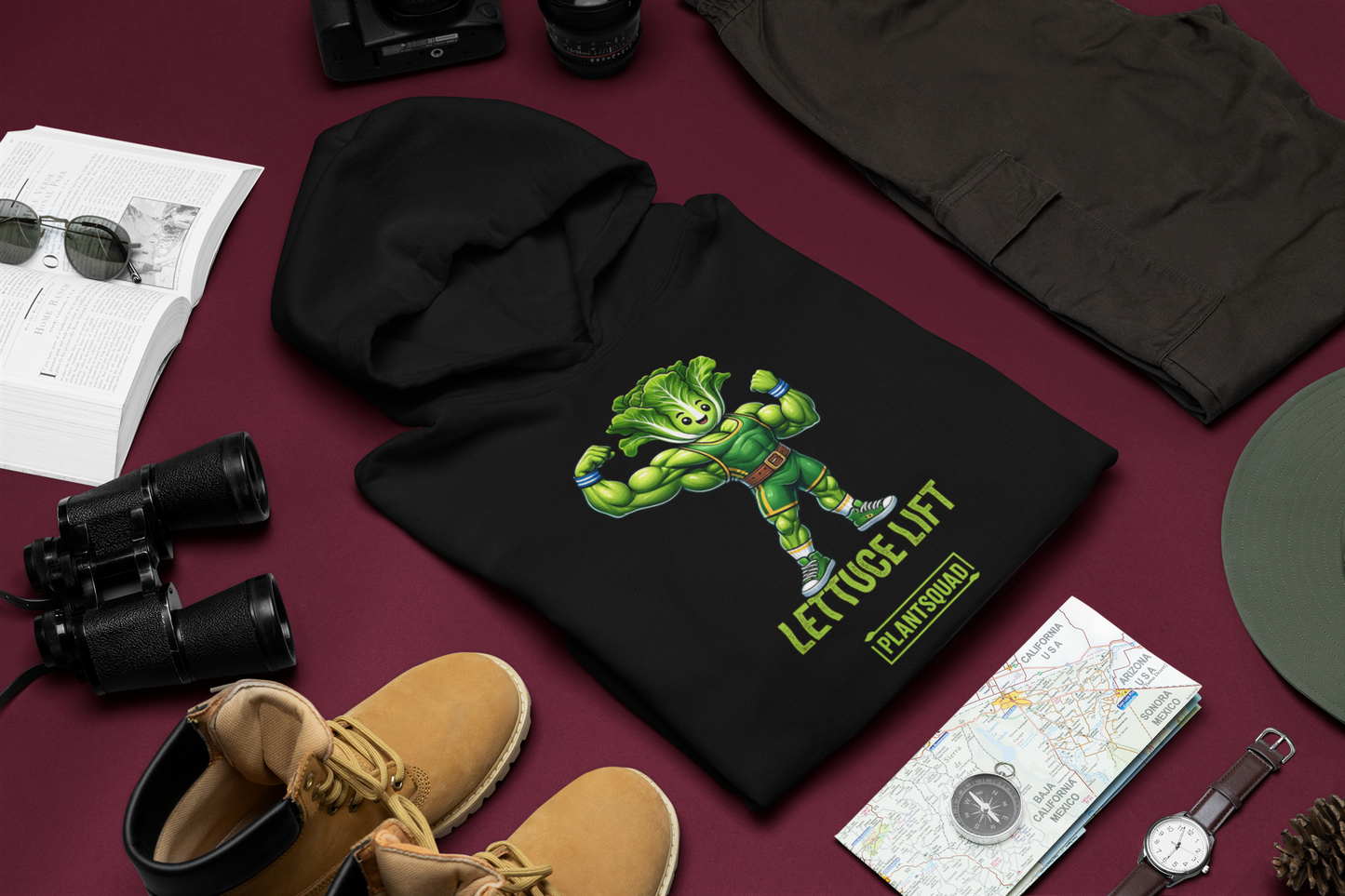 The Plantsquad Lettuce "Lettuce Lift" - Unisex Hoodie features a cartoon muscular head of lettuce with a determined expression, flexing its arms. Below it, the text reads "LETTUCE LIFT" in bold yellow-green letters and "PLANTSQUAD" in a smaller green banner - perfect for embracing your vegan lifestyle and weight lifting passion.