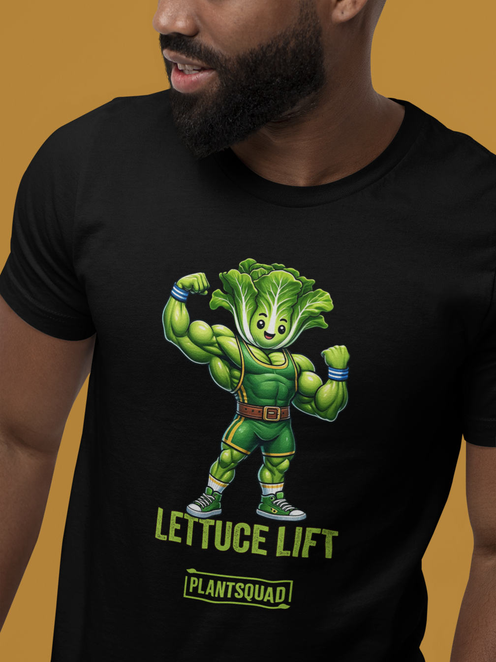 A Plantsquad Lettuce "Lettuce Lift" - Unisex T-Shirt featuring a muscular anthropomorphic lettuce flexing its arms. Below the image, the text reads "LETTUCE LIFT" in bold green letters, with "PLANTSQUAD" in a smaller font—perfect for fitness enthusiasts embracing a plant-based lifestyle.