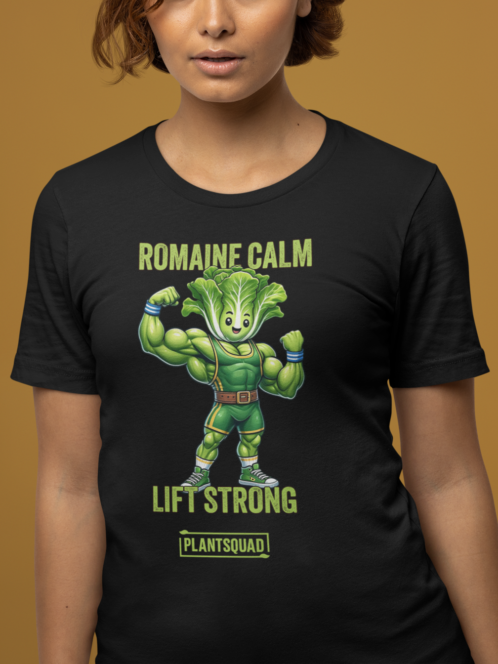 Product Name: Plantsquad Lettuce "Romaine Calm Lift Strong" - Unisex T-Shirt

Sentence: A black T-shirt featuring an illustration of a muscular, anthropomorphic lettuce lifting weights. Perfect for fitness enthusiasts embracing a vegan lifestyle, it reads "ROMAINE CALM" above the illustration and "LIFT STRONG" below, with "Plantsquad Lettuce 'Romaine Calm Lift Strong' - Unisex T-Shirt" at the bottom.