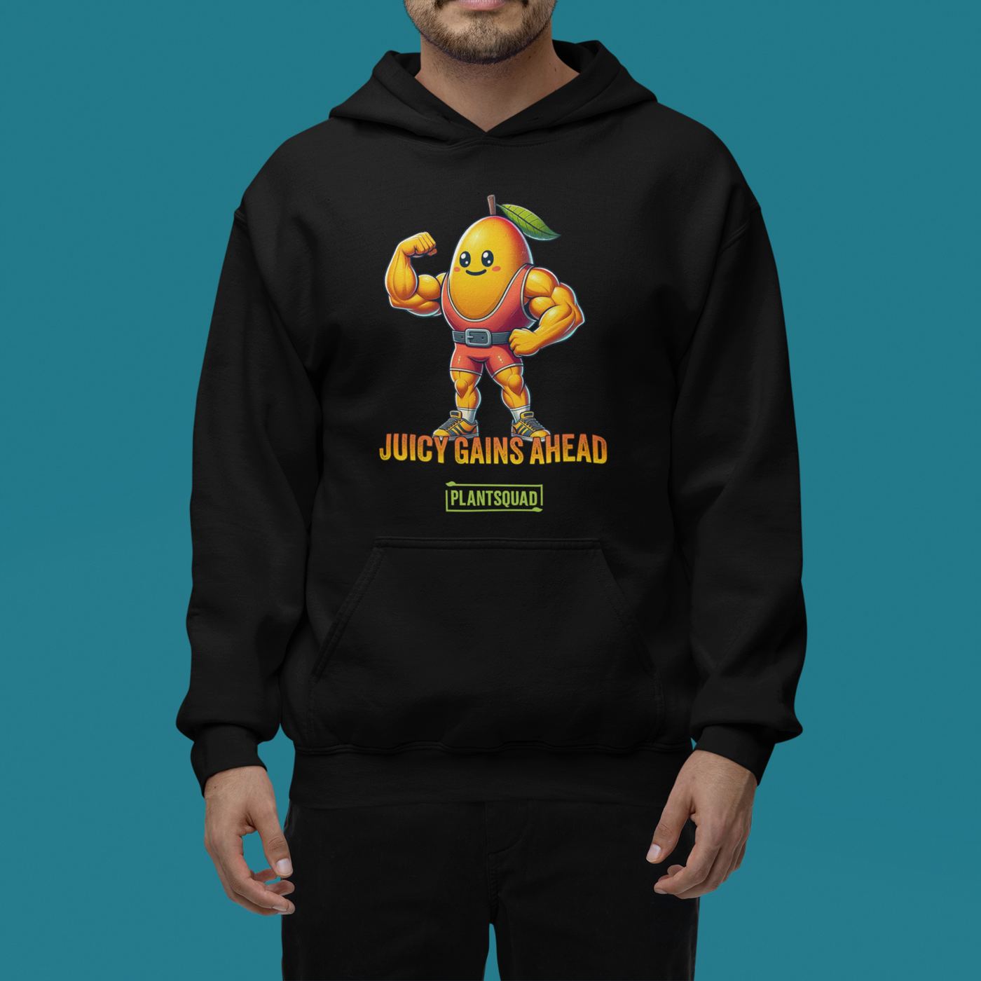 A black Plantsquad Mango "Juicy Gains Ahead" - Unisex Hoodie features a muscular mango cartoon flexing its biceps, donning a green leaf on its head. Below the mango, the text reads "Juicy Gains Ahead" in bold orange letters and "Plant Squad" in a green rectangular box, perfect for showcasing your vegan lifestyle.