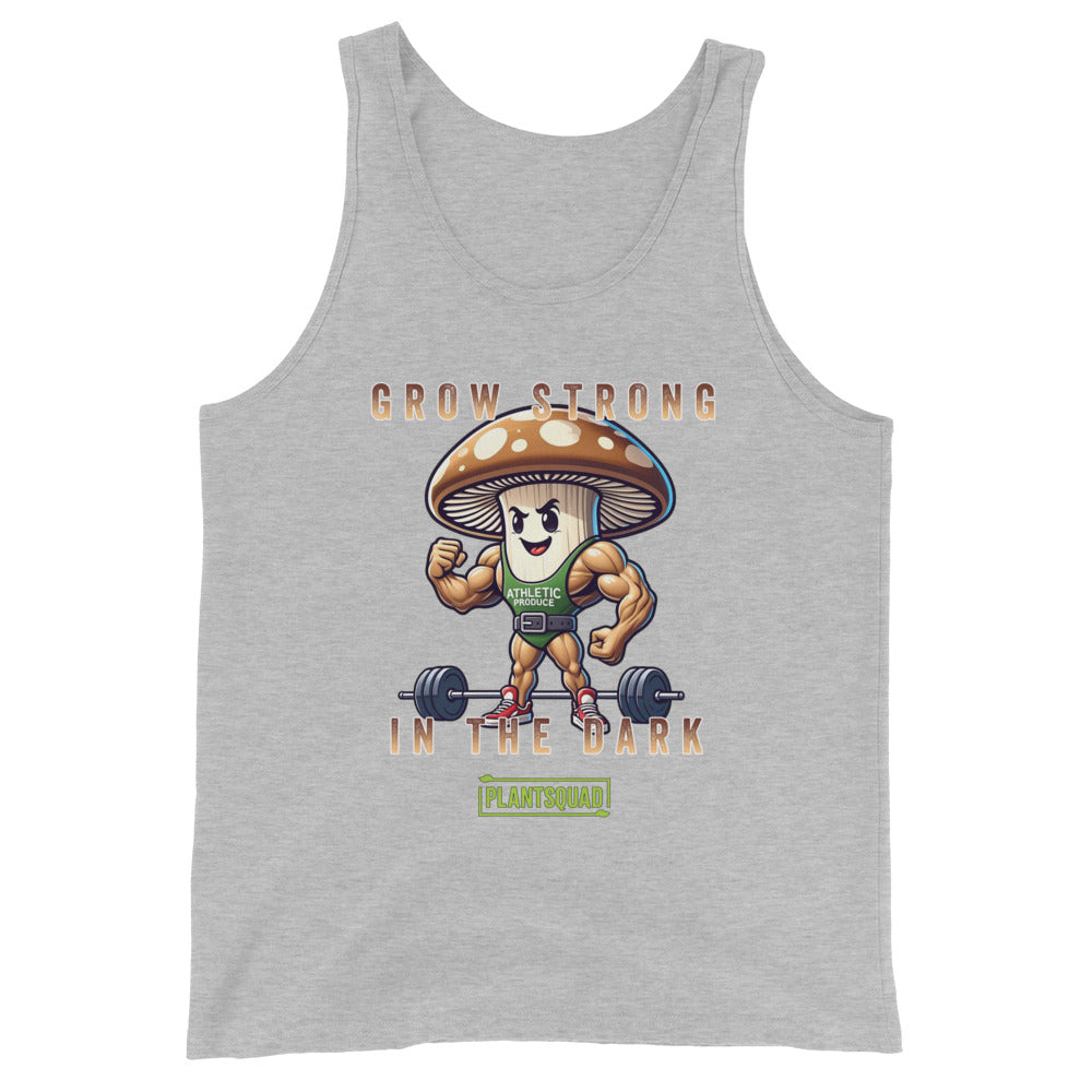 A black Plantsquad Mushroom "Grow Strong In The Dark" - Unisex Tank Top features a cartoon mushroom lifting weights with muscular arms. Text above and below the mushroom reads, "Grow Strong in the Dark - PlantSquad". Perfect for gym enthusiasts embracing a plant-based lifestyle, the mushroom sports a green athletic shirt with "ATHLETIC" on it.