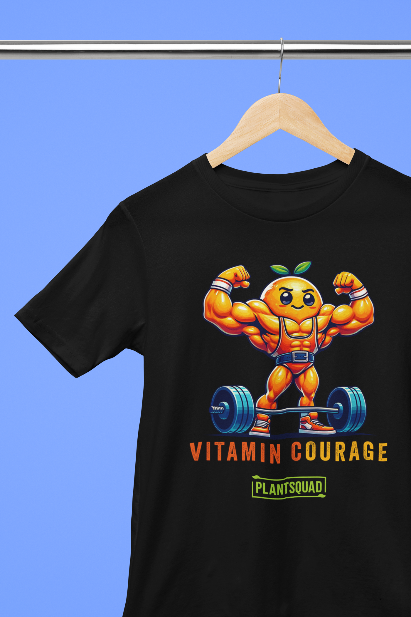 Plantsquad Orange "Vitamin Courage" - Unisex T-Shirt featuring a muscular, anthropomorphic orange lifting a barbell. The text reads "VITAMIN COURAGE" above and "PLANTSQUAD" inside a green rectangle below the image, perfect for fitness enthusiasts and those embracing a plant-based lifestyle.