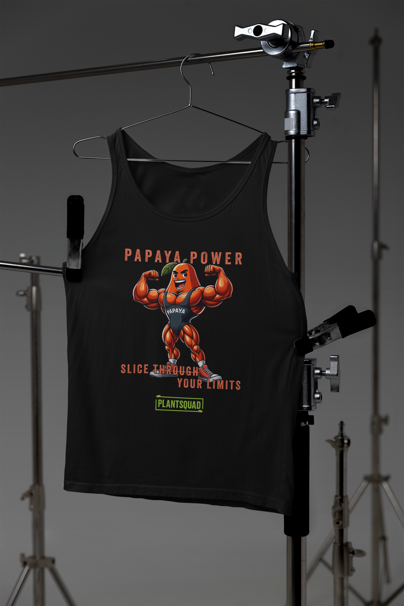 A Plantsquad Papaya "Papaya Power Slice Through Your Limits" - Unisex Tank Top featuring an illustration of a muscular papaya fruit character wearing gym attire, flexing its arms. The text reads "PAPAYA POWER" at the top, "SLICE THROUGH YOUR LIMITS" in the middle, and "PLANTSQUAD" at the bottom – perfect for those embracing a vegan lifestyle.