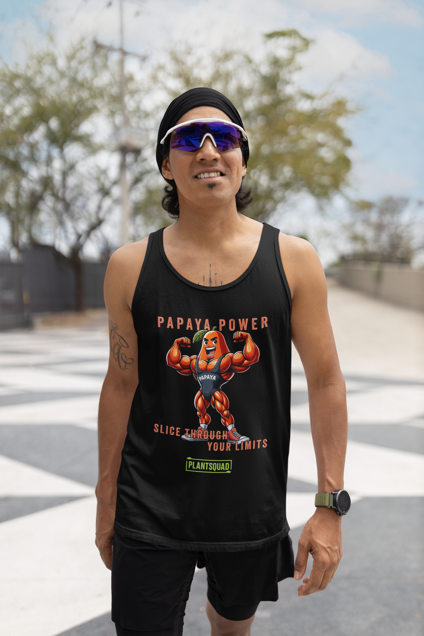 A Plantsquad Papaya "Papaya Power Slice Through Your Limits" - Unisex Tank Top featuring an illustration of a muscular papaya fruit character wearing gym attire, flexing its arms. The text reads "PAPAYA POWER" at the top, "SLICE THROUGH YOUR LIMITS" in the middle, and "PLANTSQUAD" at the bottom – perfect for those embracing a vegan lifestyle.