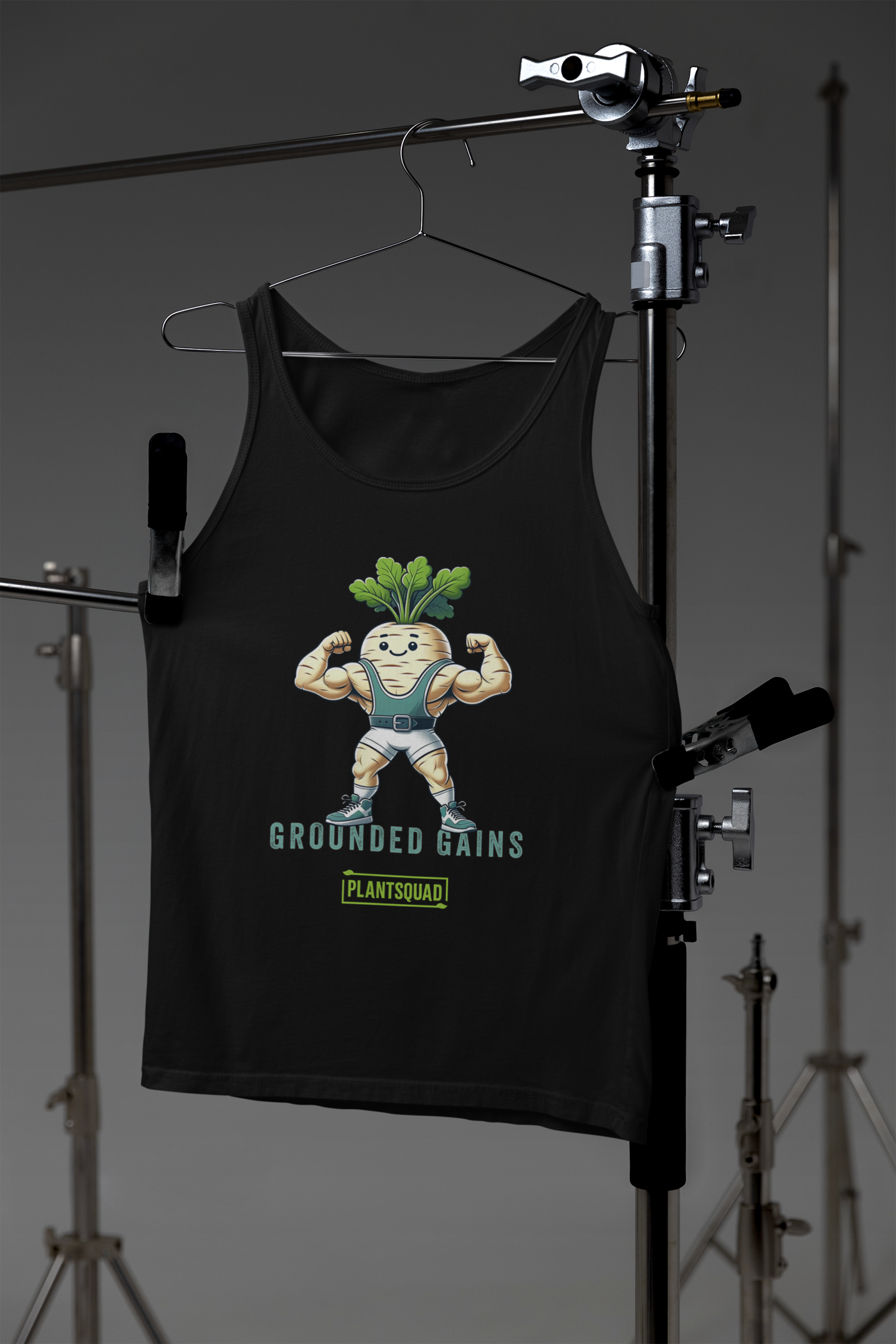 A Plantsquad Parsnip "Grounded Gains" - Unisex Tank Top featuring an illustration of a muscular radish flexing its arms in gym attire. Perfect for gym enthusiasts embracing the vegan lifestyle, it boasts the text "GROUNDED GAINS" above "PLANTSQUAD" at the bottom and is made from breathable fabric for maximum comfort.