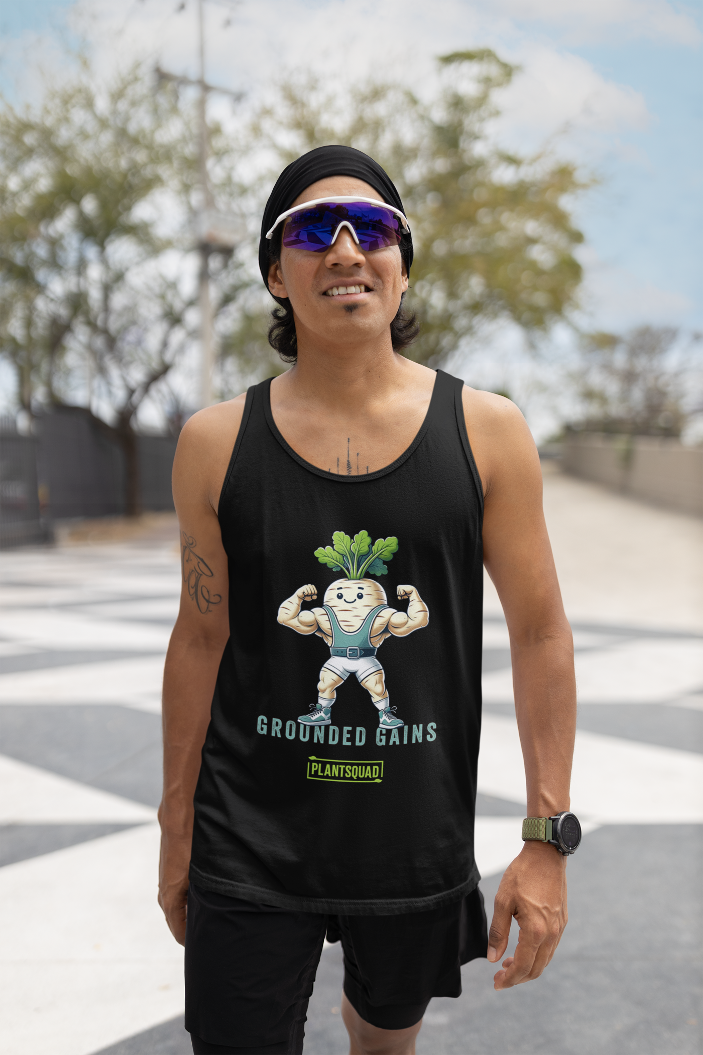 A Plantsquad Parsnip "Grounded Gains" - Unisex Tank Top featuring an illustration of a muscular radish flexing its arms in gym attire. Perfect for gym enthusiasts embracing the vegan lifestyle, it boasts the text "GROUNDED GAINS" above "PLANTSQUAD" at the bottom and is made from breathable fabric for maximum comfort.