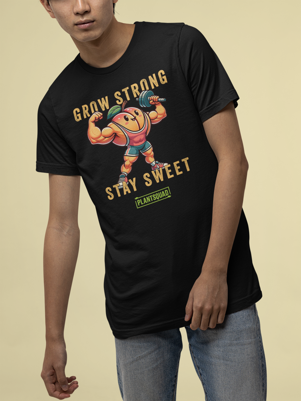 The Plantsquad Peach "Grow Strong Stay Sweet" - Unisex T-Shirt features an illustration of a muscular, anthropomorphic peach wearing a headband, wristbands, and shorts, lifting a barbell. The text above reads "GROW STRONG" and below reads "STAY SWEET" with a "PLANTSQUAD" logo at the bottom. Perfect for those embracing a plant-based lifestyle and fitness apparel.