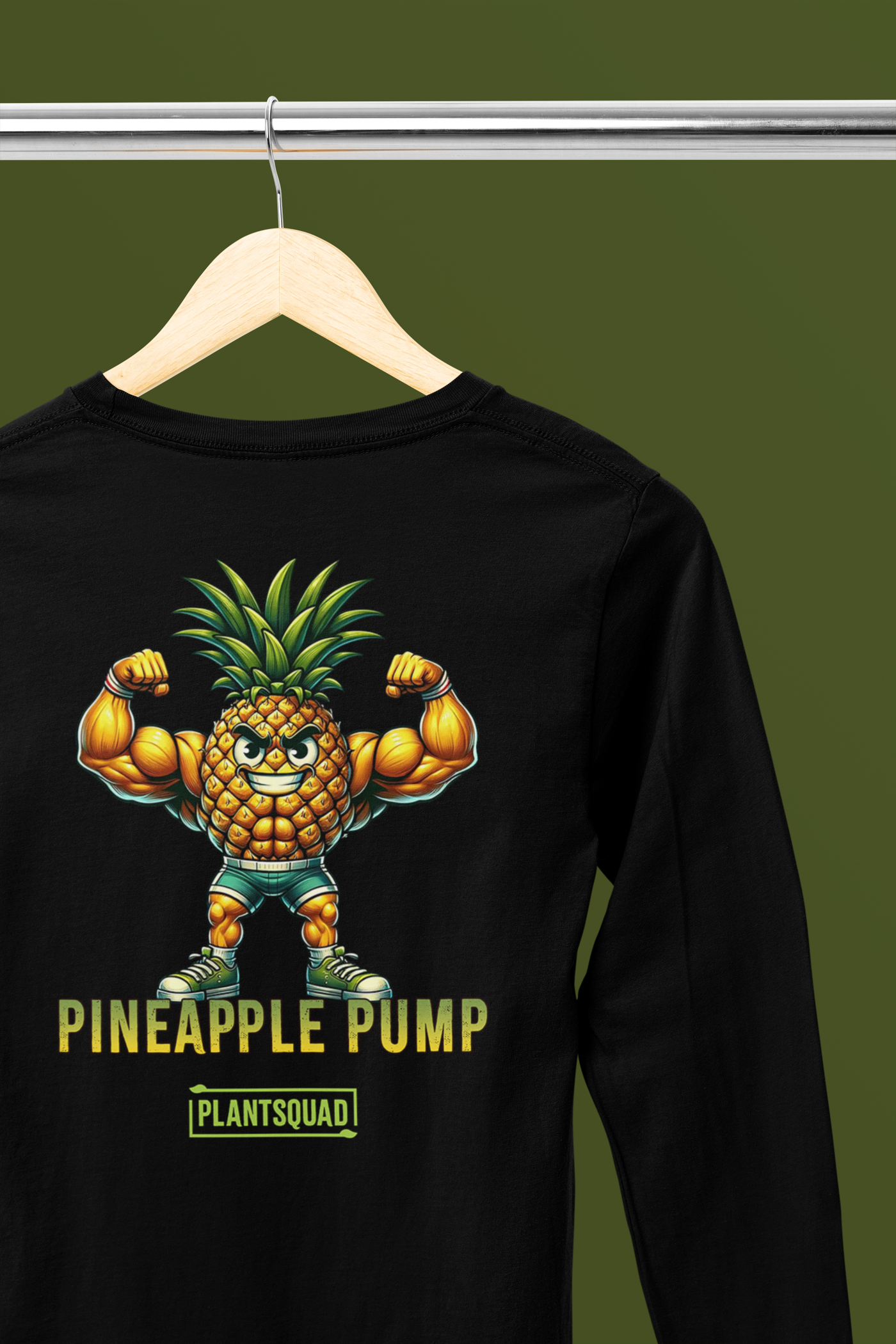 A **Plantsquad Pineapple "Pineapple Pump" - Unisex Long Sleeve T-Shirt** showcases a muscular anthropomorphic pineapple flexing its arm muscles. Below the pineapple, the text reads "Pineapple Pump" in bold yellow font, and underneath, "PLANTSQUAD" in a green box—perfect for fitness enthusiasts who embrace a vegan lifestyle.