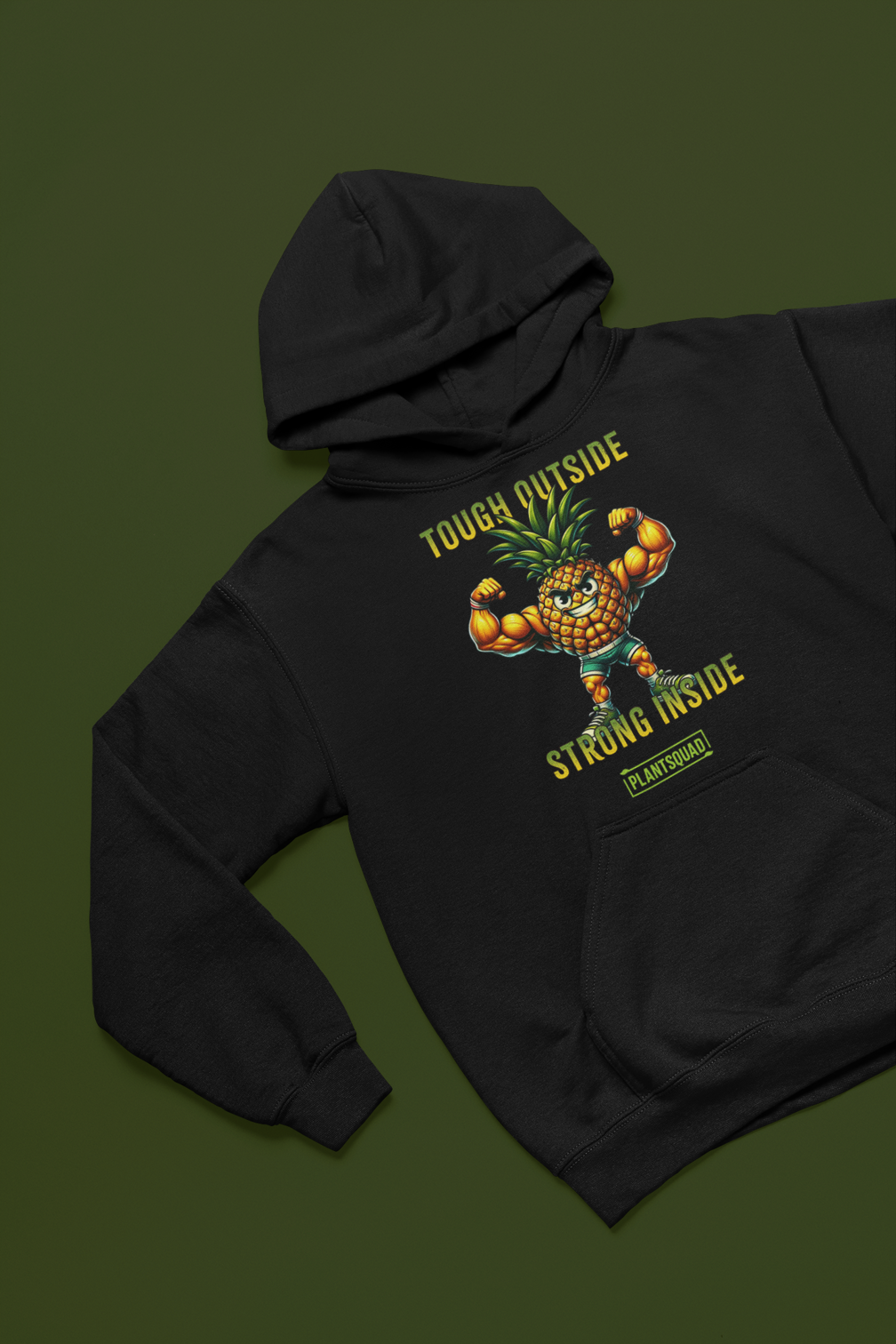 A cozy fabric black Plantsquad Pineapple "Tough Outside Strong Inside" - Unisex Hoodie featuring a muscular pineapple design with green leaves on its head. The pineapple flexes its muscles, with text above reading "Tough Outside," and below, "Strong Inside." Perfect for those embracing a vegan lifestyle, the word "PLANTSQUAD" is also proudly displayed.