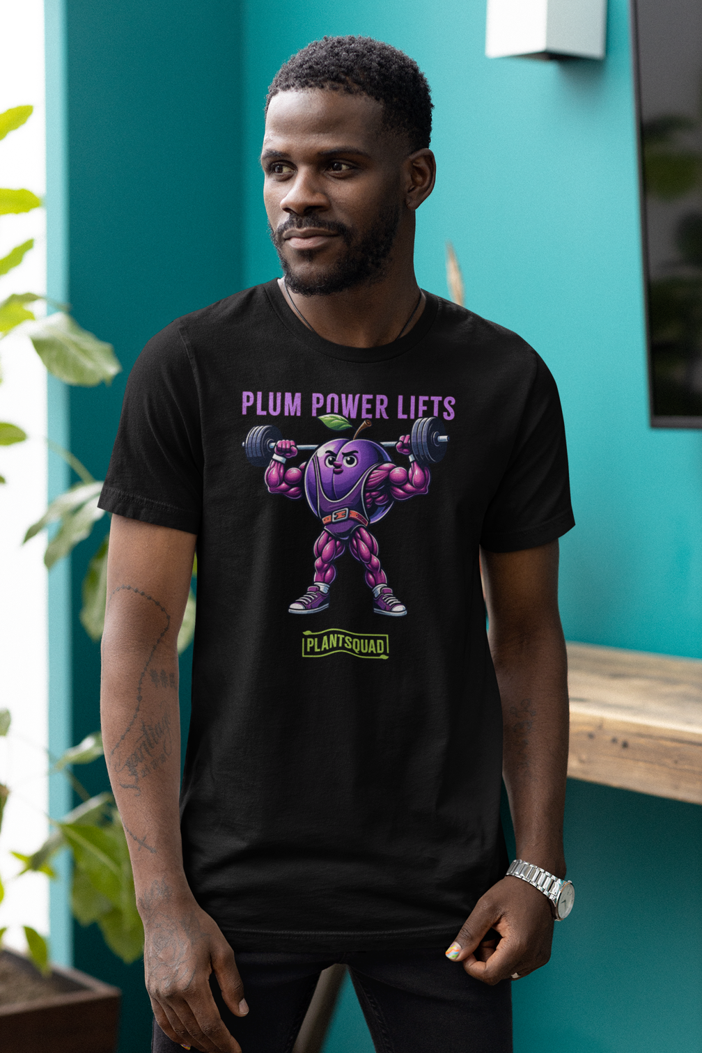 Plantsquad Plum "Plum Power Lifts" - Unisex T-Shirt featuring a cartoon plum with muscular arms and legs lifting a barbell. The text above the image reads "Plum Power Lifts" and below it, there's a logo with "PLANTSQUAD." Perfect for fitness enthusiasts embracing a vegan lifestyle, the plum character is depicted in a vibrant, exaggerated style.