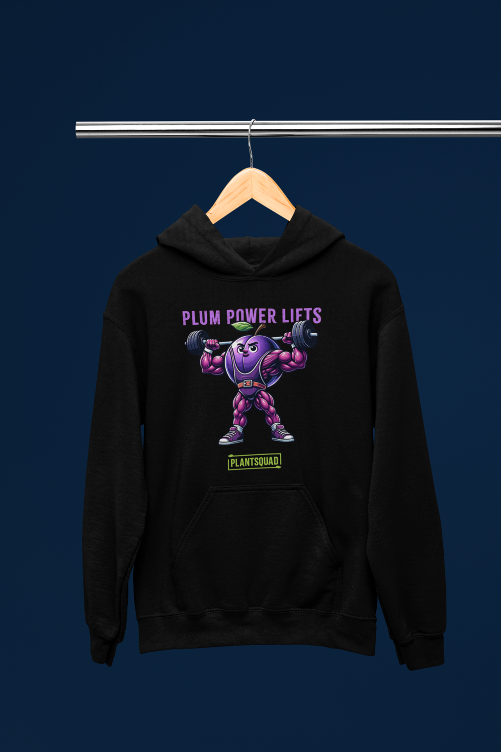 **Plantsquad Plum "Plum Power Lifts" - Unisex Hoodie** featuring a muscular cartoon plum character lifting barbells. Above the character, the text reads "PLUM POWER LIFTS" in purple letters. Below the character, the text reads "PLANT SQUAD" in green letters, perfect for those embracing a plant-based or vegan lifestyle.