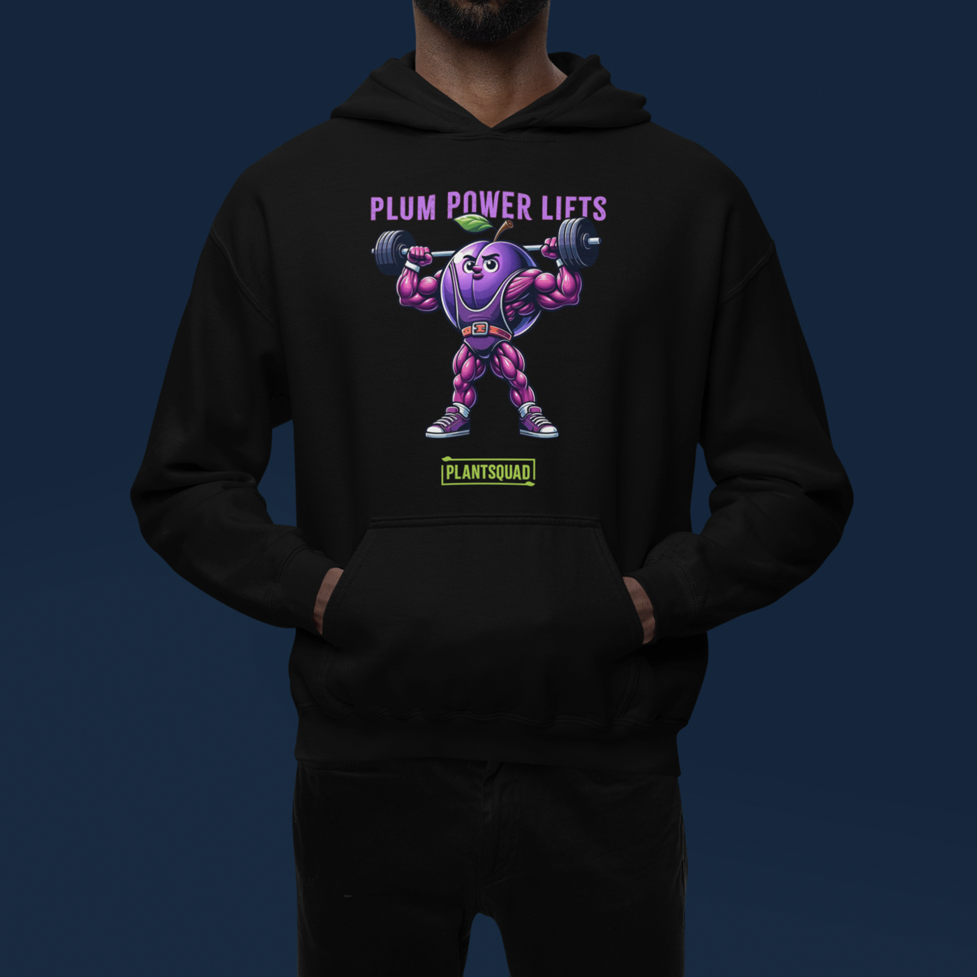 **Plantsquad Plum "Plum Power Lifts" - Unisex Hoodie** featuring a muscular cartoon plum character lifting barbells. Above the character, the text reads "PLUM POWER LIFTS" in purple letters. Below the character, the text reads "PLANT SQUAD" in green letters, perfect for those embracing a plant-based or vegan lifestyle.