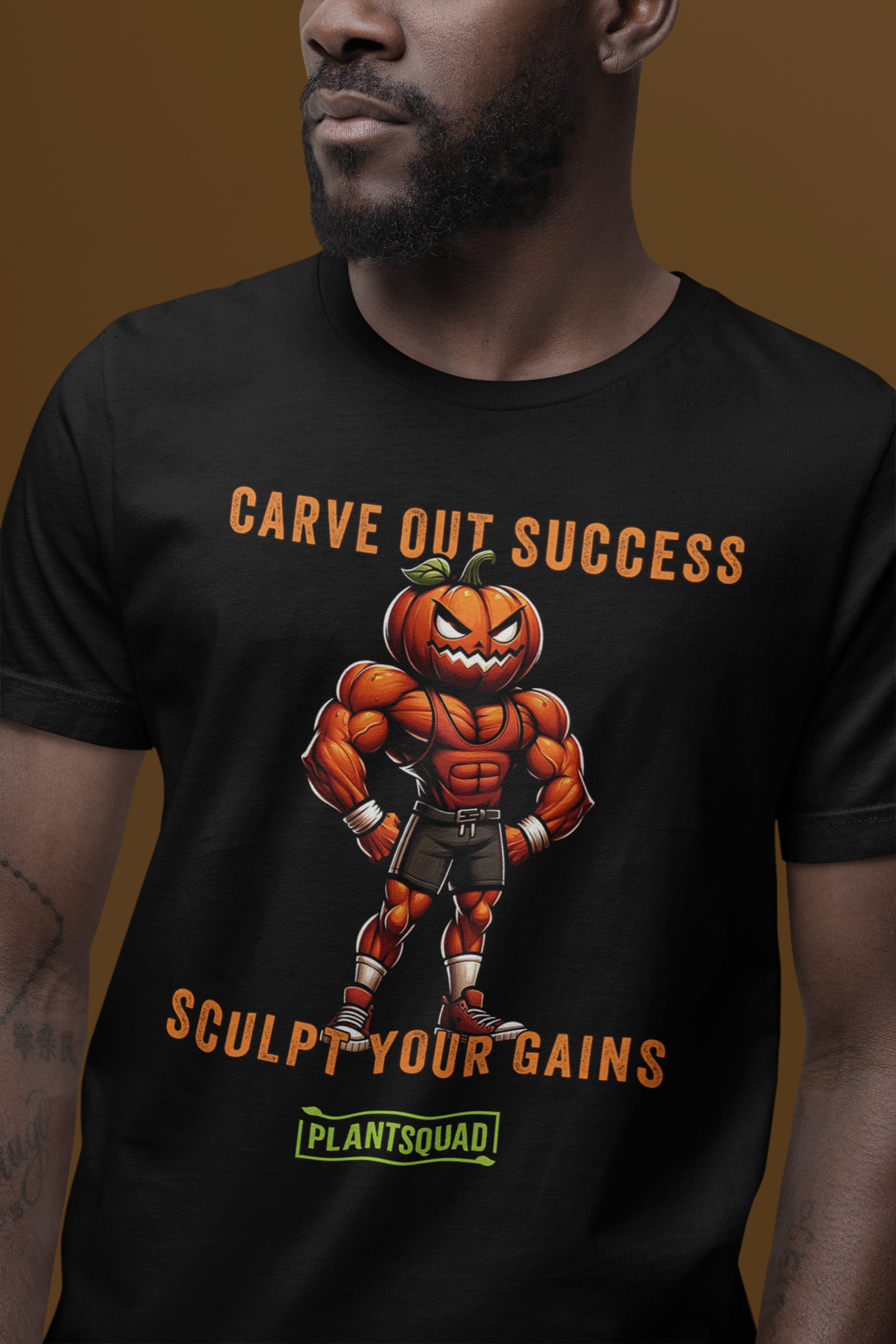 Plantsquad Pumpkin "Carve Out Your Success Sculpt Your Gains" - Unisex T-Shirt featuring a muscular pumpkin-headed character in gym attire. The text above the character says "CARVE OUT SUCCESS," and below reads "SCULPT YOUR GAINS." Perfect for fitness enthusiasts and those embracing a plant-based lifestyle, the bottom text says "PLANTSQUAD" in a green box.