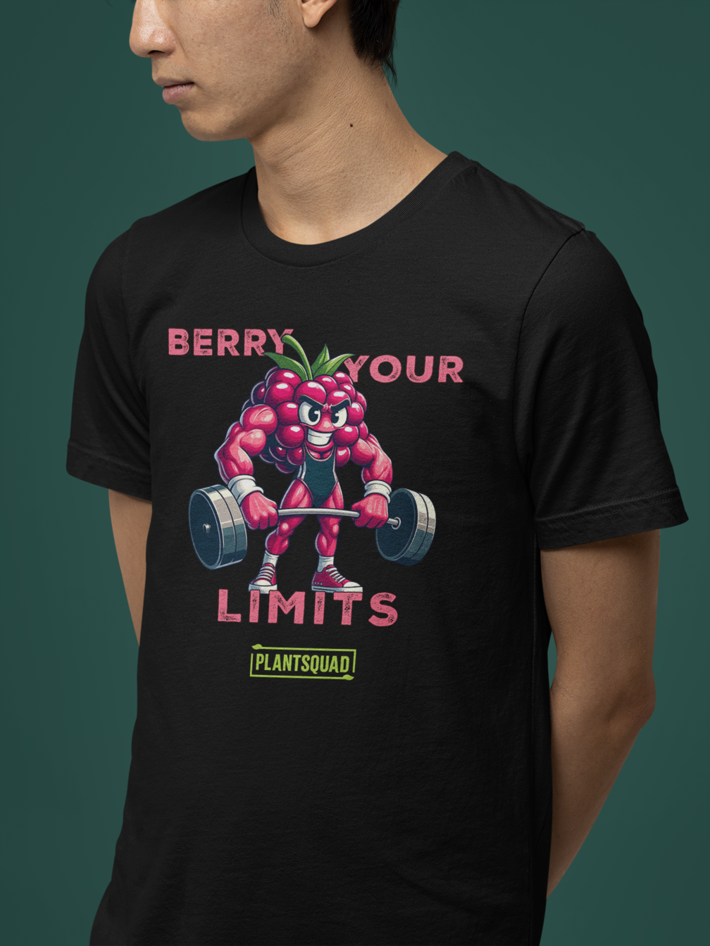 A black t-shirt displays a muscular anthropomorphic berry lifting dumbbells. Above, text reads, "Berry Your Limits," celebrating vegan fitness. At the bottom, the word "PlantSquad" is enclosed in a green box. The berry character is detailed with sneakers and a prominent expression.

Product Name: Plantsquad Raspberry "Berry Your Limits" - Unisex T-Shirt