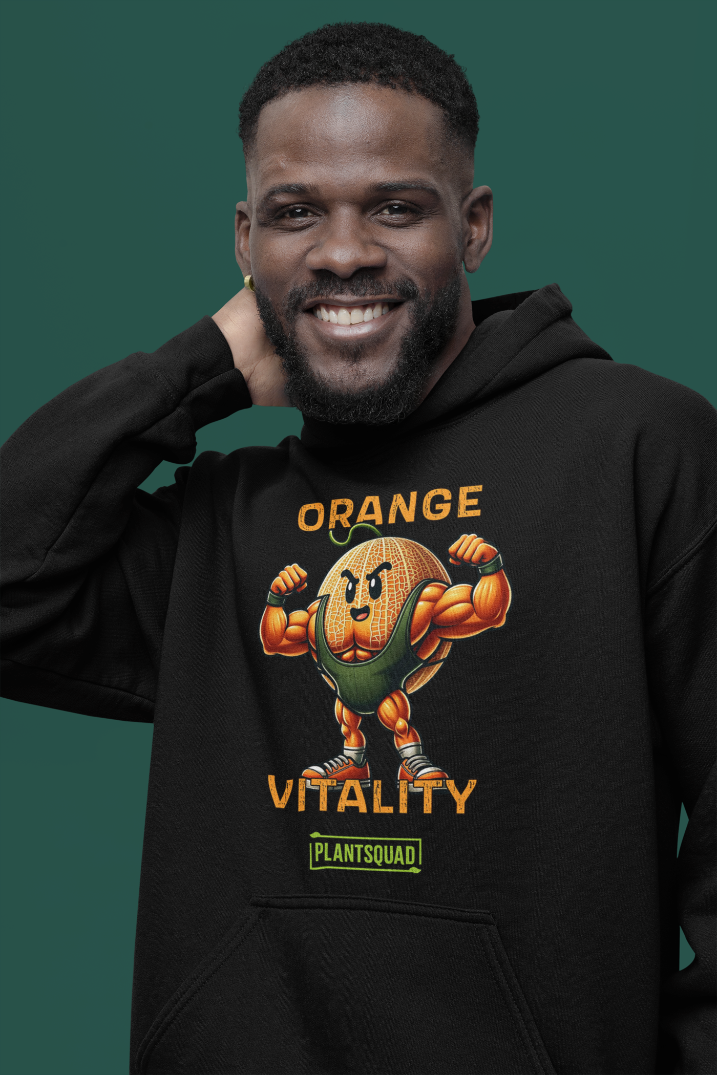 A black hooded sweatshirt boasts a muscular, cartoon orange with a fierce expression, flexing its arms. Above the orange, text reads "ORANGE VITALITY." Below it, a logo with the text "PLANTSQUAD" celebrates the vegan lifestyle. The product is called Plantsquad Rockmelon "Orange Vitality"" - Unisex Hoodie.