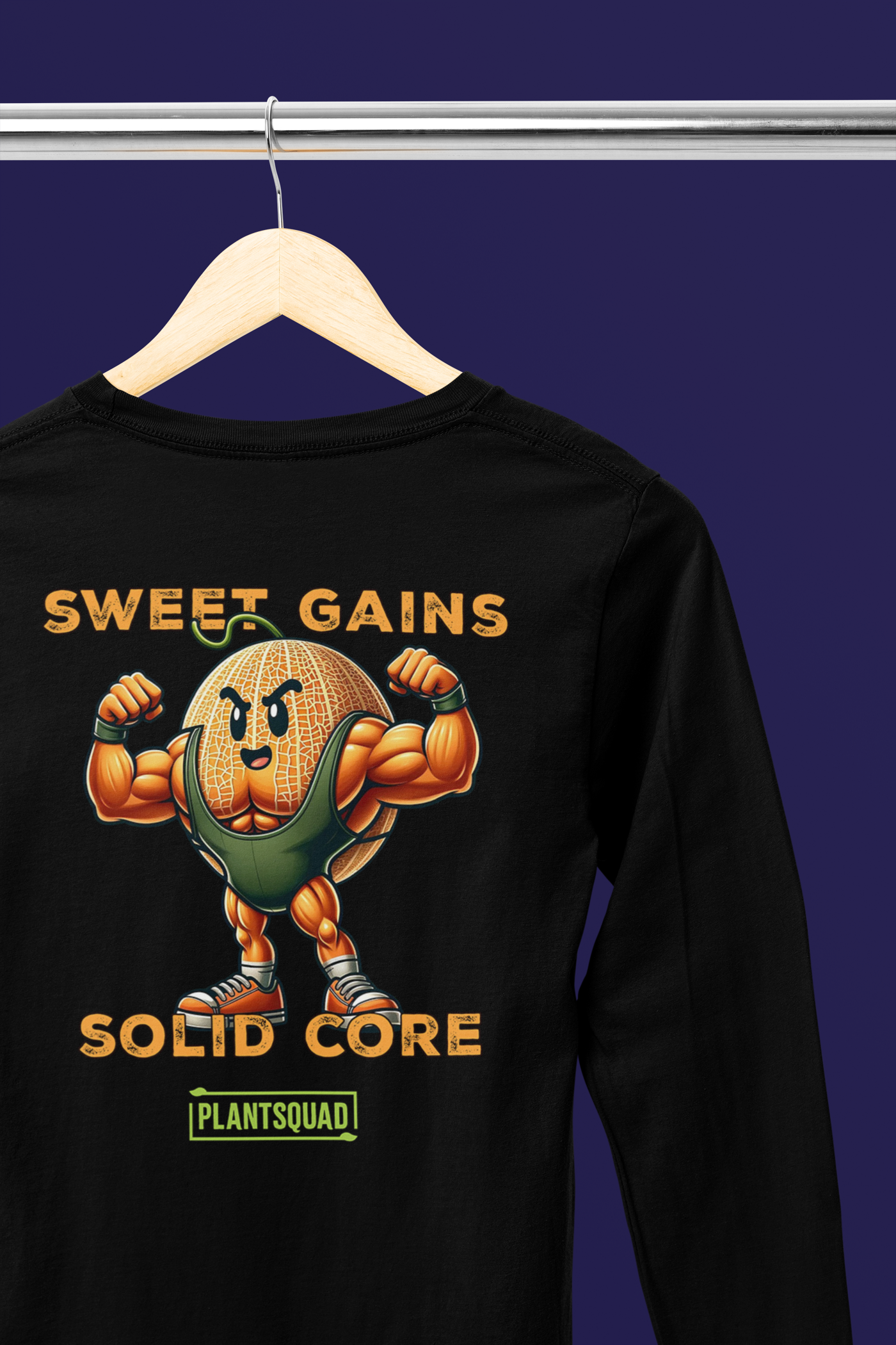 A black long-sleeve shirt features a muscular cartoon carrot flexing its arms. Above the carrot, the text reads "Sweet Gains," and below it, "Solid Core." Beneath this, "PLANTSQUAD" is printed within a green rectangular box, showcasing vegan fitness apparel for those embracing a plant-based lifestyle. The product is named Plantsquad Rockmelon "Sweet Gains Solid Core" - Unisex Long Sleeve T-Shirt.
