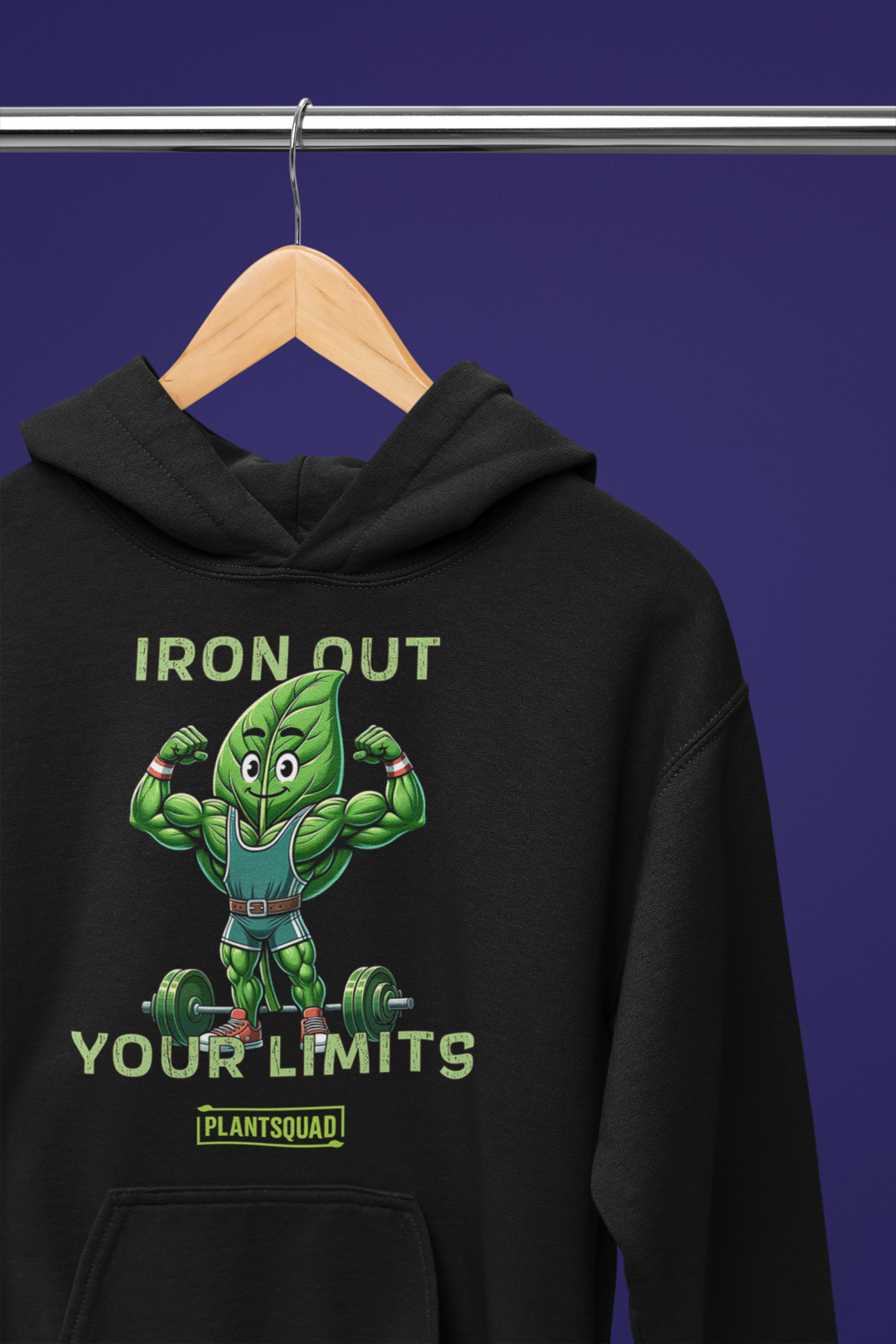 A **Plantsquad Spinach "Iron Out Your Limits" - Unisex Hoodie** features a cartoon illustration of a muscular leaf character lifting a barbell. The text above and below the character reads, "IRON OUT YOUR LIMITS," with "PLANTSQUAD" on a banner beneath, celebrating the vegan lifestyle.