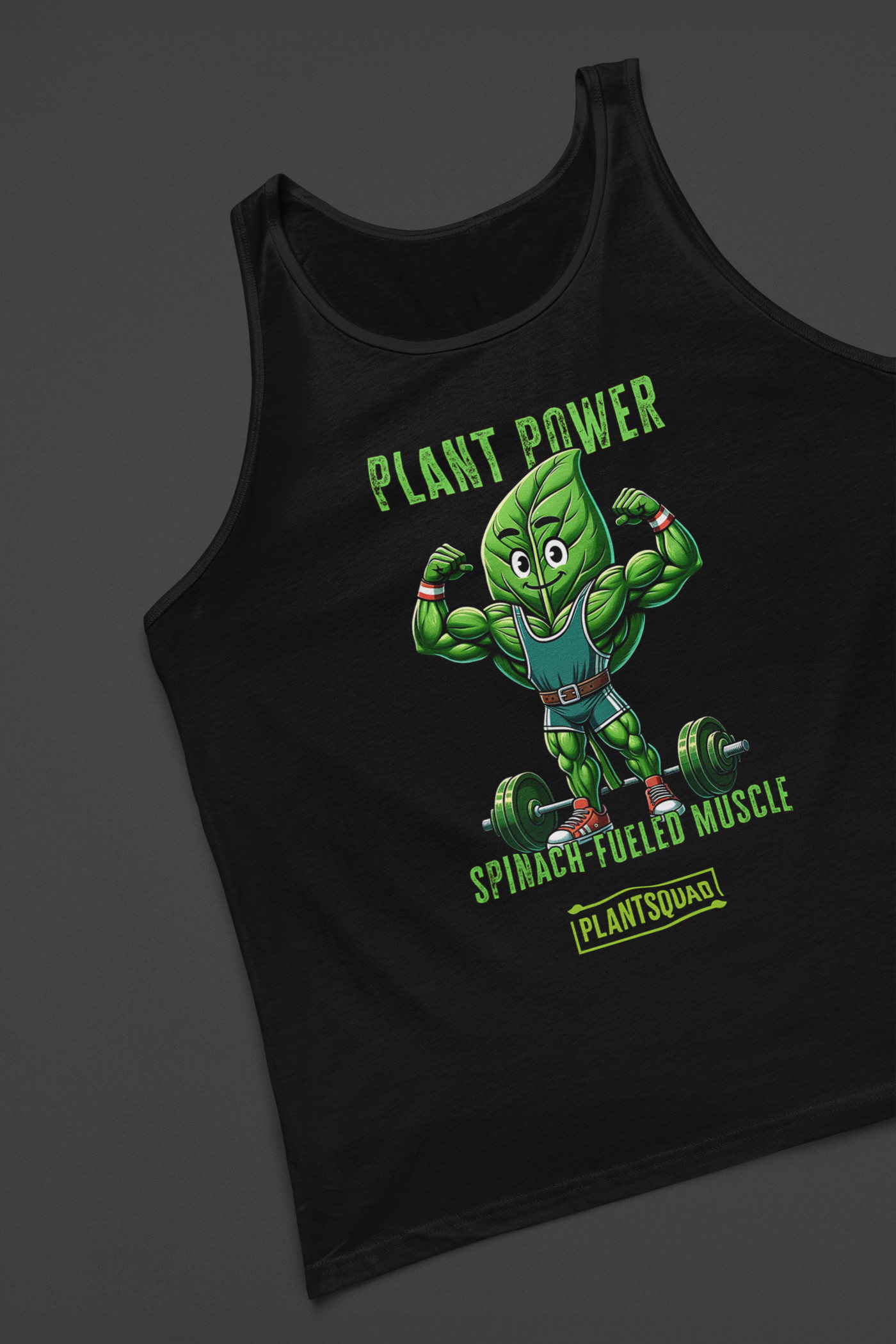 A Plantsquad Spinach "Plant Power Spinach Fueled Muscle" - Unisex Tank Top features a strong cartoon spinach character lifting weights. The text above the character reads "Plant Power," while below it says "Spinach-Fueled Muscle" and "Plantsquad Fitness Apparel." The design promotes a plant-based workout and strength.