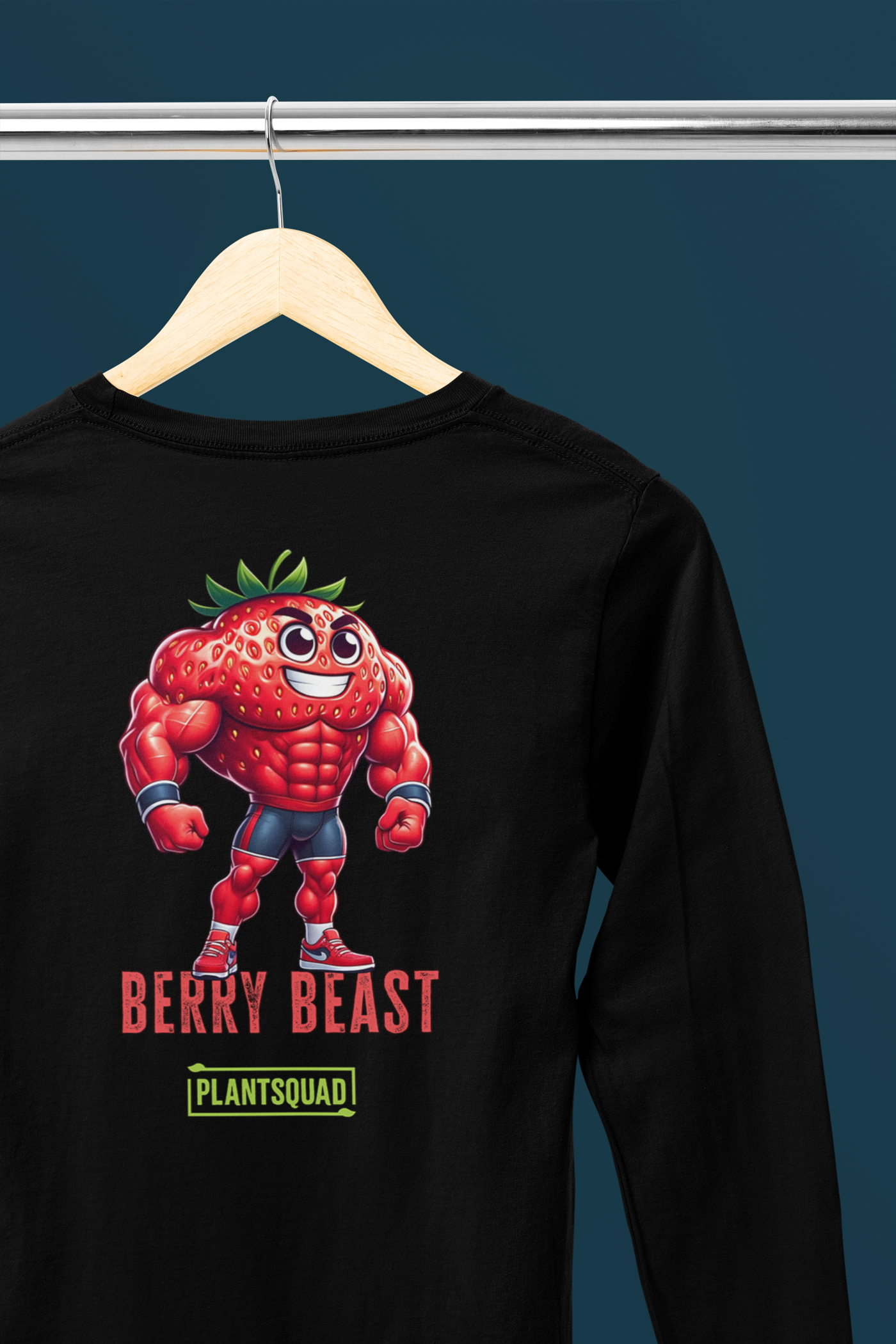 The Plantsquad Strawberry "Berry Beast" - Unisex Long Sleeve T-Shirt features a muscly strawberry cartoon character with the text "Berry Beast" in bold red and purple letters above the word "Plantsquad" in a green box. Perfect for fitness enthusiasts embracing a vegan lifestyle, this design showcases strength in style.