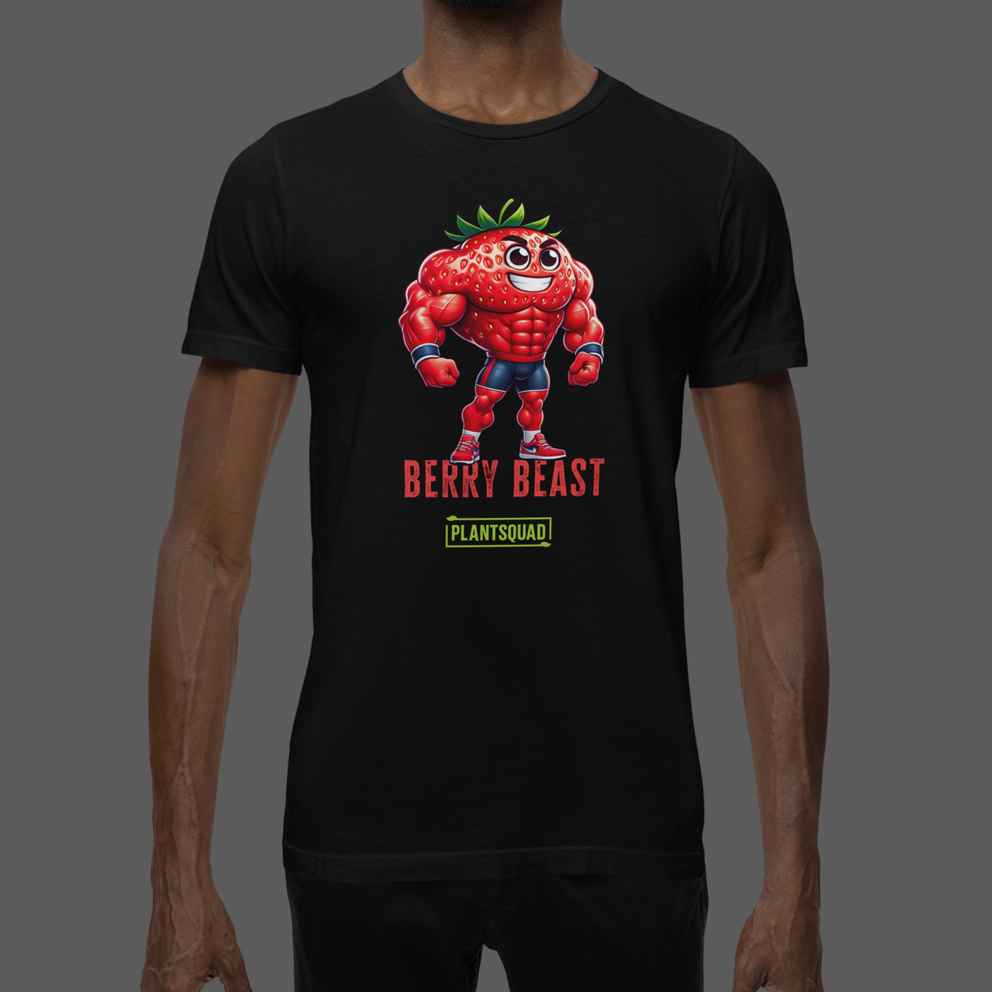 A black T-shirt displays a muscular cartoon strawberry character with arms crossed, wearing sneakers. Perfect for fitness enthusiasts, the design features "BERRY BEAST" in red and "PLANTSQUAD" in green, making it ideal for those embracing a vegan lifestyle. This is the Plantsquad Strawberry "Berry Beast" - Unisex T-Shirt.