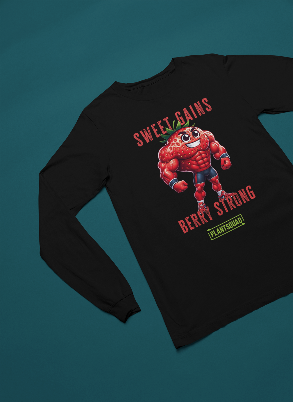 A Plantsquad Strawberry "Sweet Gains Berry Strong" - Unisex Long Sleeve T-Shirt features a muscular, anthropomorphic strawberry flexing its arms. Above and below the strawberry, the text reads "Sweet Gains Berry Strong." Perfect for fitness enthusiasts embracing a vegan lifestyle, the word "PLANTSQUAD" appears in a green box at the bottom of the design.