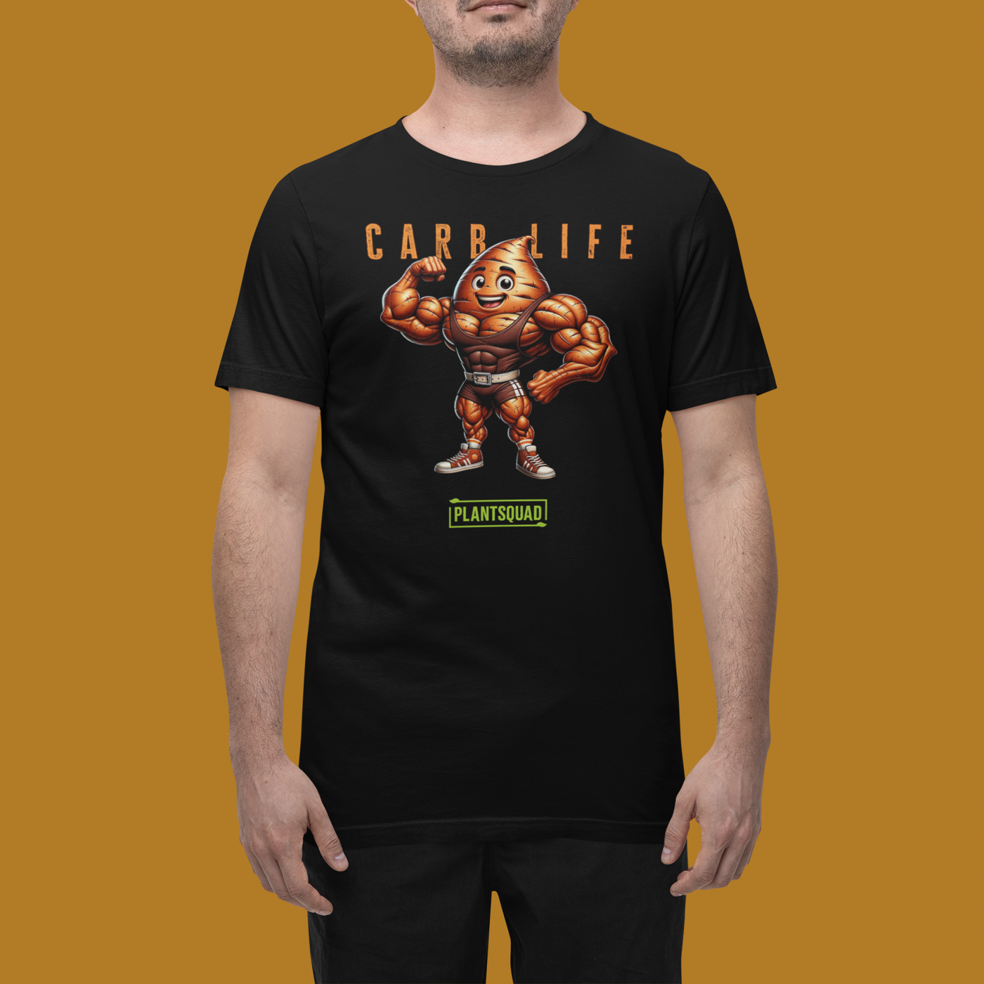 Plantsquad Sweet Potato "Carb Life" - Unisex T-Shirt featuring a muscular, flexing potato character with a smiley face. Above the character, text reads "CARB LIFE" in bold letters. Below the character, the word "PLANTSQUAD" appears in a green banner. Perfect for those embracing a plant based lifestyle and looking for unique fitness clothing.