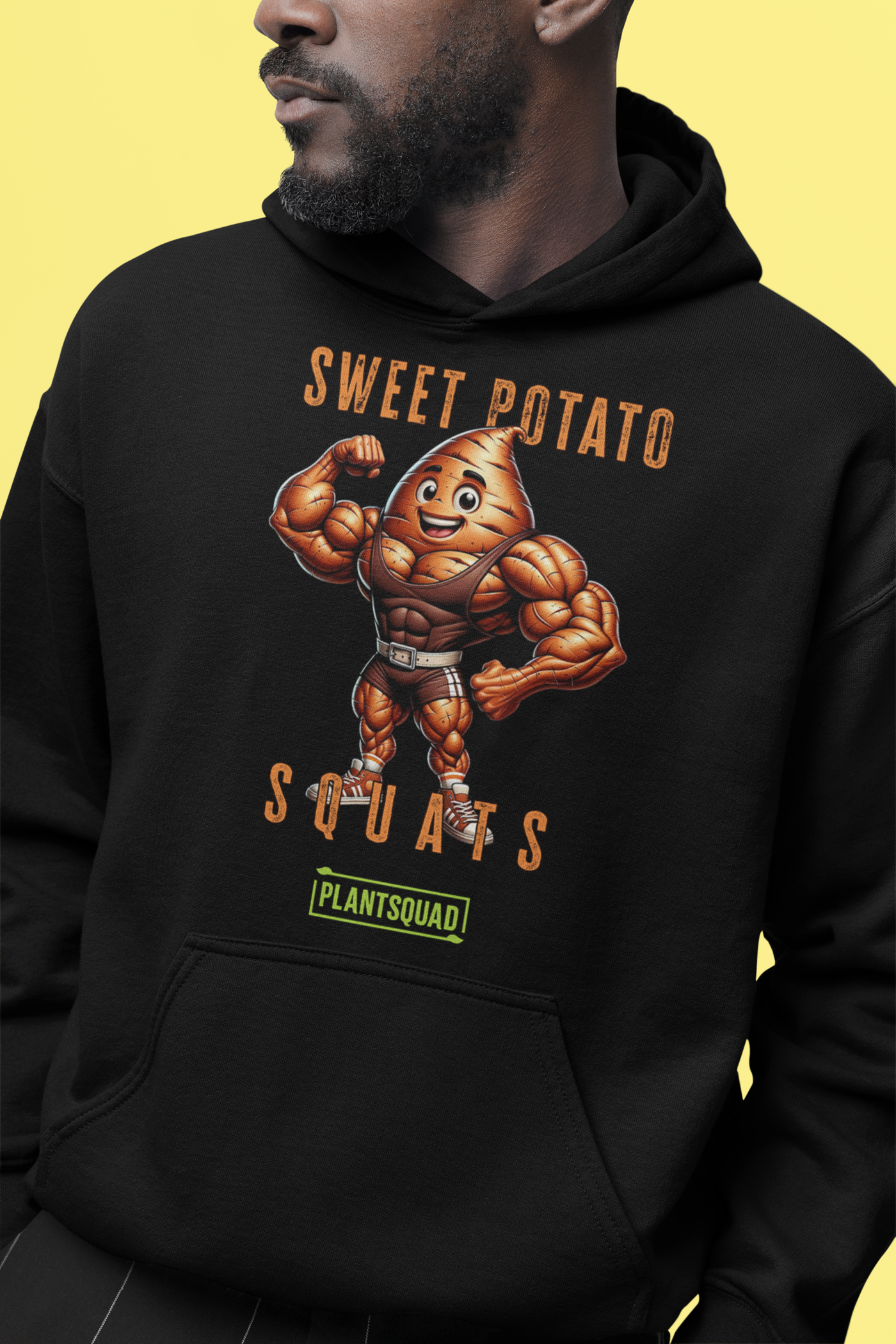 A black Plantsquad Sweet Potato "Sweet Potato Squats" - Unisex Hoodie featuring a muscular anthropomorphic sweet potato flexing its arms. The text above reads "Sweet Potato Squats" and below reads "Plantsquad." The sweet potato character is smiling, wearing a weightlifting belt, and the cozy fabric makes it perfect for anyone embracing the vegan lifestyle.