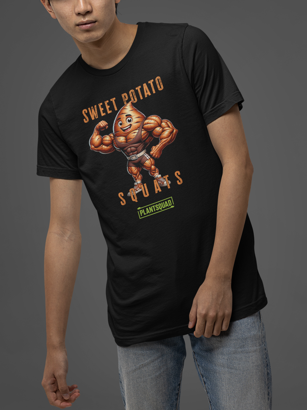 A Plantsquad Sweet Potato "Sweet Potato Squats" - Unisex T-Shirt featuring a muscular cartoon sweet potato character flexing its biceps. The text above the character reads "Sweet Potato" and below it reads "Squats." There is a green logo at the bottom with the text "PLANTSQUAD." Perfect for vegan fitness enthusiasts embracing a plant-based lifestyle.