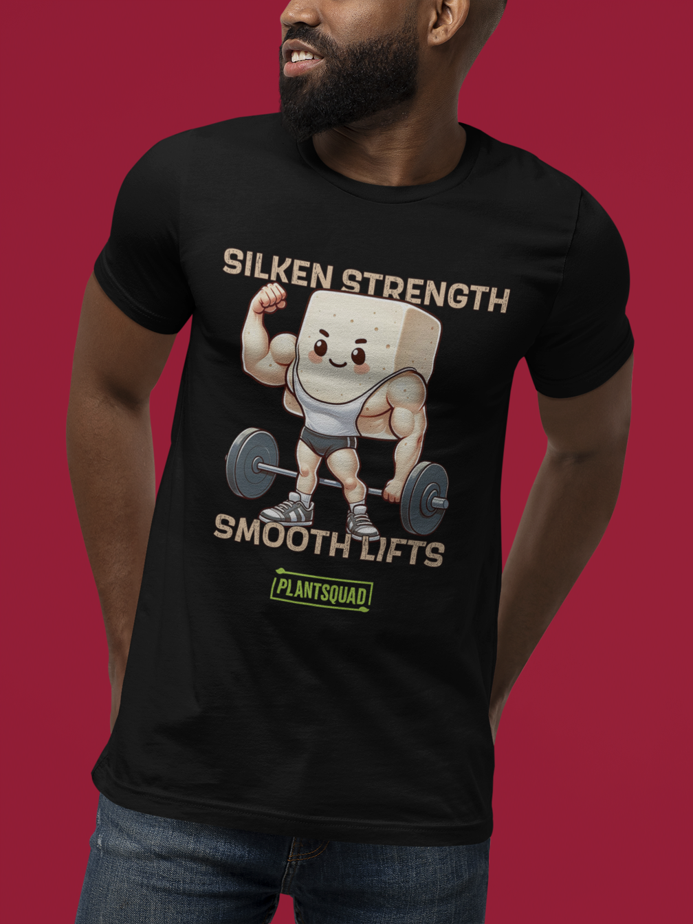 A black Plantsquad Tofu "Silken Strength Smooth Lifts" - Unisex T-Shirt featuring a muscly tofu cartoon character lifting weights. The text reads "Silken Strength" above the character and "Smooth Lifts" below. A green label with "PLANTSQUAD" at the bottom celebrates your plant-based lifestyle.