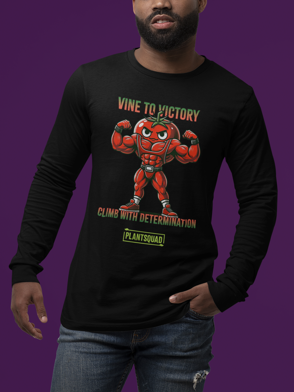 The Plantsquad Tomato "Vine To Victory Climb With Determination" - Unisex Long Sleeve T-Shirt features a muscly tomato design, with a cartoon tomato character flexing its arms. Above it, the text reads "Vine to Victory." Below the tomato, the text says "Climb with Determination." Below that is the word "PlantSquad" in a green box—perfect for fitness enthusiasts and those embracing a vegan lifestyle.