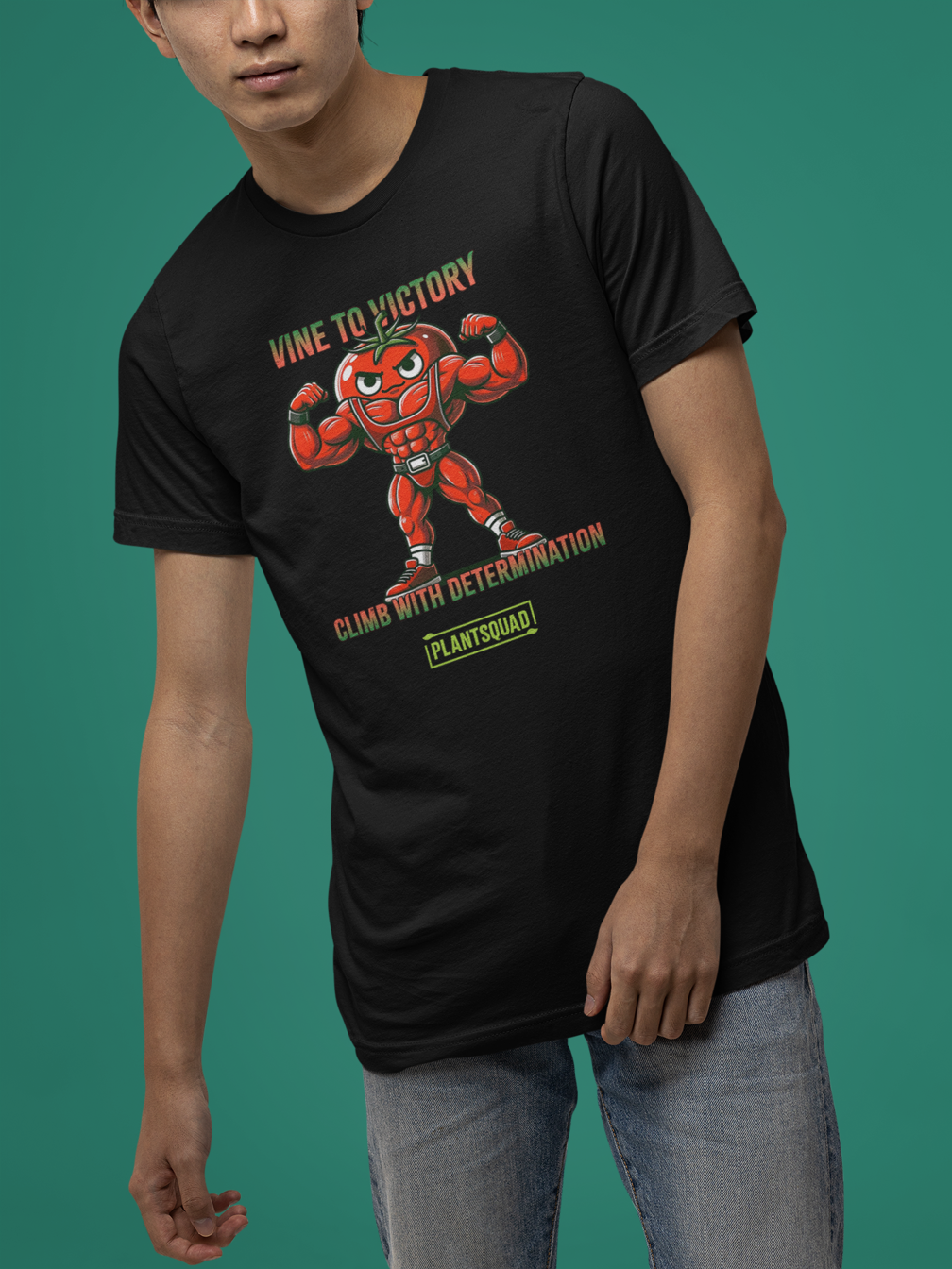 A Plantsquad Tomato "Vine To Victory Climb With Determination" - Unisex T-Shirt featuring an illustration of a muscular, anthropomorphic tomato flexing its arms. Perfect for fitness enthusiasts, the text above reads "Vine to Victory," and below, it says "Climb with Determination." The word "Plantsquad" is written at the bottom in a green box.