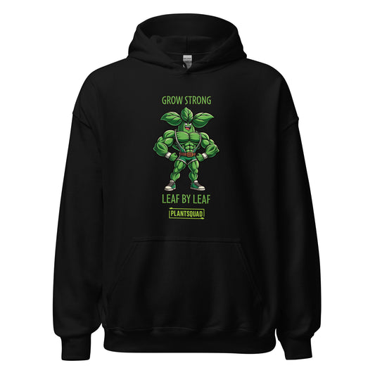 The **Plantsquad Basil "Grow Strong Leaf By Leaf" - Unisex Hoodie** features a green, plant-based cartoon superhero with basil leaves for muscles and a leaf emblem on the chest. Above the character, text reads "GROW STRONG." Below it says, "LEAF BY LEAF." At the bottom, there's a "PLANTSQUAD" logo. Perfect for showcasing your vegan lifestyle!