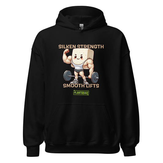 A black hoodie featuring a graphic of a muscular tofu block lifting a barbell. Text above reads "Silken Strength" and below "Smooth Lifts." Embrace the plant-based lifestyle with the "PlantSquad" logo at the bottom. The smiling tofu character, in a white tank top and shorts, makes weight lifting look fun! Get yours now: Plantsquad Tofu "Silken Strength Smooth Lifts" - Unisex Hoodie.