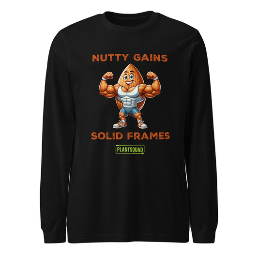 The Plantsquad Almond "Nutty Gains Solid Frames" - Unisex Long Sleeve T-Shirt features a muscly almond cartoon flexing its biceps. Above it are the words "NUTTY GAINS," and below is "SOLID FRAMES." At the bottom, there is a green rectangle with the word "PLANTSQUAD" in yellow letters, perfect for those embracing a vegan fitness lifestyle.