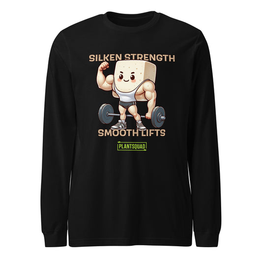 A Plantsquad Tofu "Silken Strength Smooth Lifts" - Unisex Long Sleeve T-Shirt features a muscly tofu cartoon lifting weights. Above the graphic, text reads "SILKEN STRENGTH" and below reads "SMOOTH LIFTS." Beneath the tofu, a green and yellow logo displays "PLANTSQUAD," making it perfect for fitness enthusiasts embracing a vegan lifestyle.