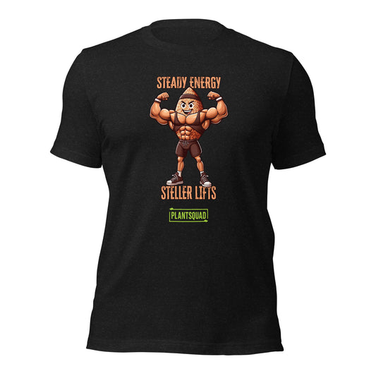 A black t-shirt features an illustration of a muscular peanut character flexing its arms. Above the character, text reads "STEADY ENERGY," and below, text reads "STELLAR LIFTS." A green box at the bottom proudly displays the word "Plantsquad Brown Rice 'Steady Energy Stellar Lifts' - Unisex T-Shirt.