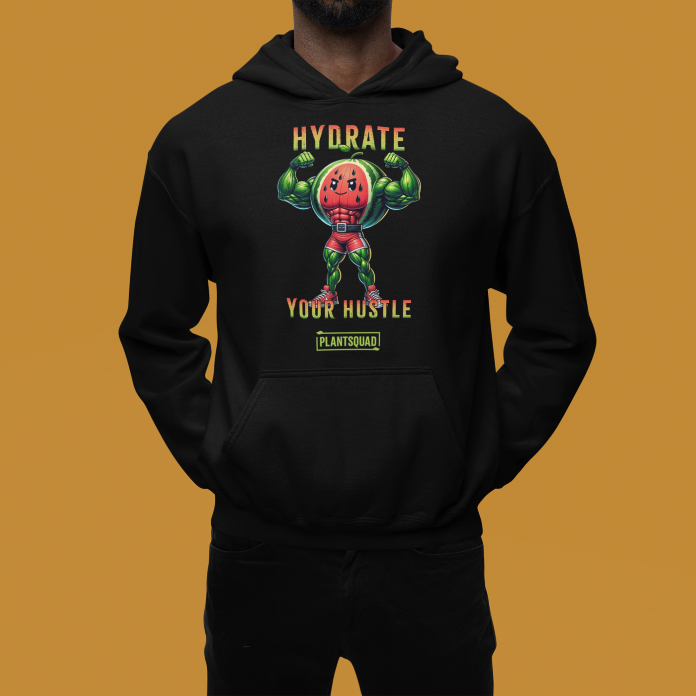 A black workout hoodie features an illustration of a muscular, anthropomorphic watermelon holding two water bottles. The text above and below the illustration reads, "Hydrate Your Hustle." Embrace your plant-based lifestyle with this stylish piece from Plantsquad Watermelon "Hydrate Your Hustle" - Unisex Hoodie.