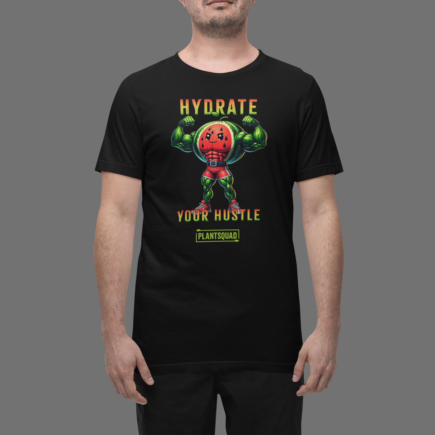 A Plantsquad Watermelon "Hydrate Your Hustle" - Unisex T-Shirt features an illustration of an anthropomorphic watermelon with muscular arms flexing. Above it, the text reads "Hydrate Your Hustle," and below, there's a logo for "Plantsquad." Embrace your vegan fitness in style as the watermelon character rocks a red singlet and green boots.