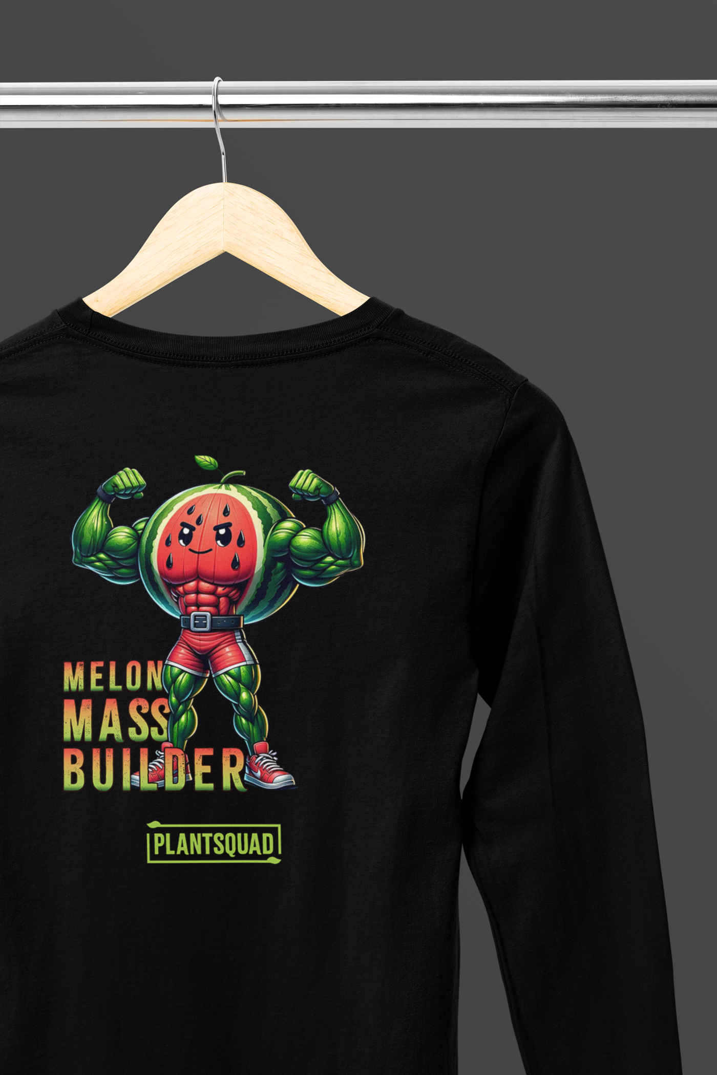 A Plantsquad Watermelon "Melon Mass Builder" - Unisex Long Sleeve T-Shirt featuring a muscular cartoon character with a watermelon head, flexing its arms. Perfect for fitness enthusiasts embracing the vegan lifestyle, the text "MELON MASS BUILDER" in red and yellow is printed next to the character, with "PLANTSQUAD" beneath it in green.