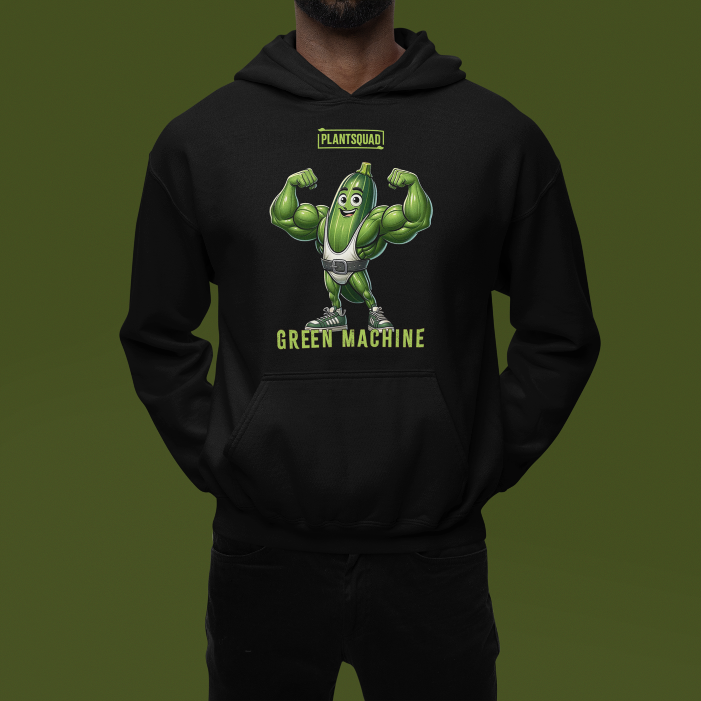 A black hoodie featuring a muscular cucumber character flexing its arms. Above the character, the text reads "PLANTSQUAD," and below it, "GREEN MACHINE" in lime-green, blocky font. This Plantsquad Zucchini "Green Machine" - Unisex Hoodie has a front pocket and a drawstring hood, perfect for those embracing a plant-based lifestyle.